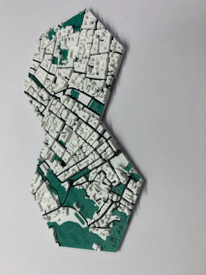 Vertical panel of two hexagonal 3D city map tiles with green parks on white